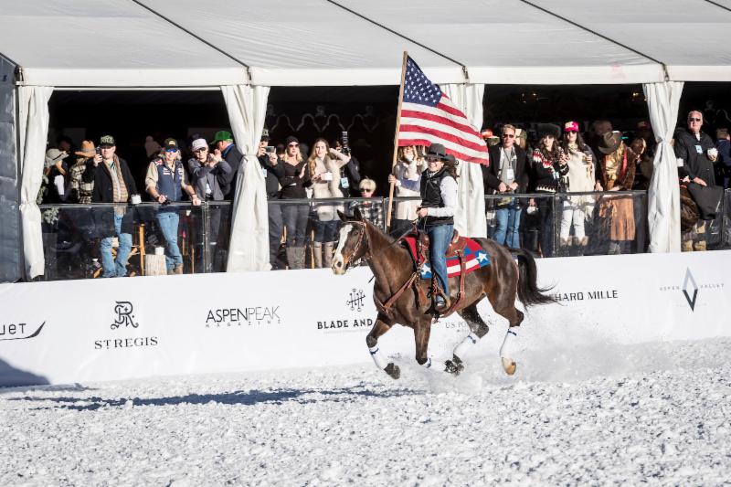 Flag-bearer-Hannah-Hayden-rides-by-t